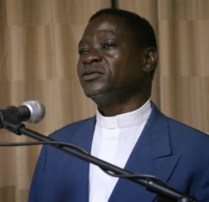 Fr.ChimkandapresentinghispapertotheMPs-PhotobyLouisSuwediECMMediaProductionsOfficer