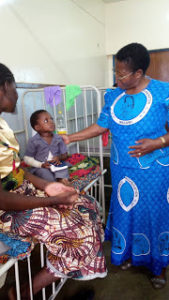 cwo-memberdr-mary-shaba-cheering-a-patient-in-childrens-ward-pix-by-prince-henderson