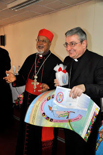 H.G. Arcbishop Luigi Bianco, Apostolic  Nuncio to Ethiopia  receiving the candle  during the Launch of AMECEA 19th  Plenary Assembly Logo in Addis