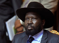 South Sudan's President Salva Kiir sits after he signed a peace agreement with South Sudan's rebel leader Riek Machar in Addis Ababa May 9, 2014. REUTERS/Tiksa Negeri (ETHIOPIA - Tags: CIVIL UNREST POLITICS)