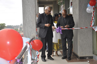 Apostolic Vicar of Soddo Rt. Rev. Tsgaye Keneni, and ECS Secretary General Fr. Hagos cuts the ribbons at the inauguration of Micro Finance Institute in Soddo 