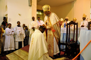 Abune Seyoum recieivng his miter from H.E. Cardinal Berhaneyesus