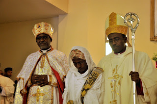 Bishop Seyoum (left) with his mother and his Bishop Rt. Rev. Abraham Desta of Meki