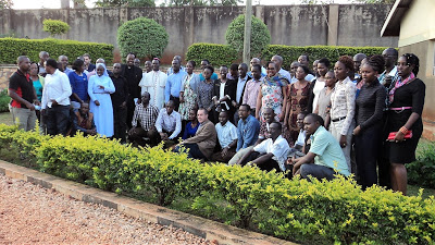 Education scholars from East Africa region pose for a group photo  with Bishop Martin Wamika of Jinja Diocese