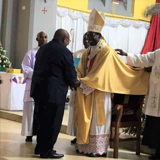  H. E. Polycarp Cardinal Pengo, Archbishop of Dar es Salaam, Tanzania being congralutated by His Excellency Benjamini Mkapa, the former President of Tanzania.