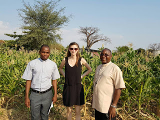Bishop Montfort Sitima (R) interracts with Jeanne Masse (C) of PMS (Missio) USA after visiting of of Mangochi diocesan farm