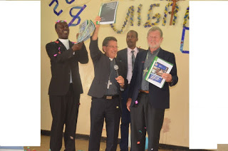 Rt. Rev. Joseph Alessandro (holding microphone) chairman Chairman of KCCB Commission for Refugees, Migrants and Seafarers, Rt. Rev. Virgilio Pante, Vice Chairman of the same Commission and KCCB Secretary General Rev. Fr. Daniel Rono (left) during the celebrations to mark 104 World Day of Migrants and Refugees in Nairobi