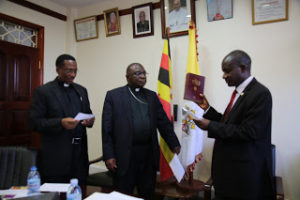The New UNCCLA president, Ndyanabo (right) takes the oath