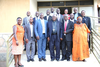 Bishop Ssemogerere pose for a group photo with the new UNCCLA Executive Committee member after the swearing in ceremony at the Uganda Catholic Secretariat premises