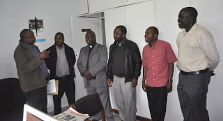 Rev. Fr. Chrisantus Ndaga, Coordinator of AMECEA Social Communications Department (Left) and  Rev. Fr. Emmanuel Chimombo  AMECEA Justice  and Peace Coordinator (2nd Left) welcomes  a section of  Participants  of the Agricultural Initiative Program  Evaluation Meeting  at AMECEA Secretariat where the participants had paid a courtesy call