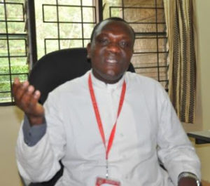 Rev. Fr. Charles Kyallo, Outgoing CUEA Chaplain in his Office