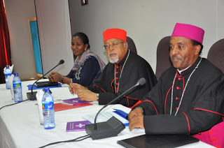 Rt. Rev. Markos Gebremedhin, CM, (right) with  H.E. Cardinal Berhaneyesus Souraphiel (center) during  the launch of Ethiopian Catholic Church Child Protection  and Nurturing Policy in Addis Ababa