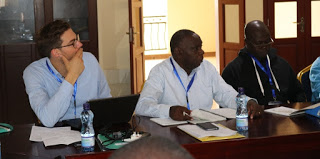 Mr. Johannes Duwe from Missio Aachen (left) with  a section of Participants listens keenly during NSCCA  Meeting in Nairobi 