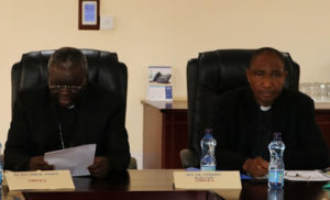 Rt. Rev. Philip Anyolo (L) Chairman of KCCB Giving Opening remarks