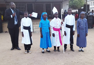 Children showcasing what they would want to  become in the future