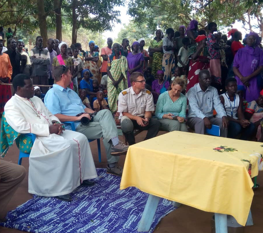 Bishop Hiiboro accompanied by partners listens to the stories of experiences from the refugees in Bidibidi Settlement Camp