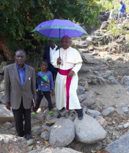 Bishop Mtumbuka is accompanied by the