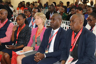 Chief Guest to the Conference Ms. Susie Kitchens,  British Deputy High Commissioner to Kenya (Center)  following presentations at the conference.  Extreme left is Prof Stephen Mbugua, Outgoing Vice  Chancellor Designate Tangaza University College