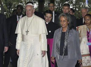 In this Thursday, Nov. 26, 2015 file photo, Pope Francis walks next to then Director-General of the United Nations Office at Nairobi (UNON) Sahle-Work Zewde, right, upon his