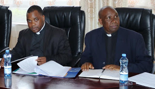 Rev. Fr. Emmanuel Chimombo (left) Deputy Secretary General  with Rev. Prof. Stephen Mbugua, CUEA Vice Chancellor 