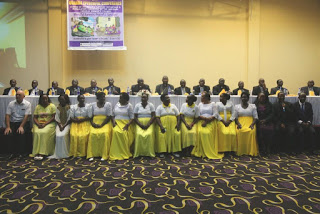 The women council pose for a group photo with the bishops and donors