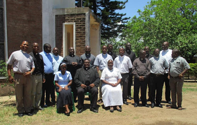 PMS Directors with Fr. Joseph Kimu, Director of Radio Maria Malawi (seated)