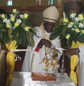 Archbishop Msusa Cuts the ribon during the Launch of the Five Years strategic plan for the Archdiocese of Blantyre