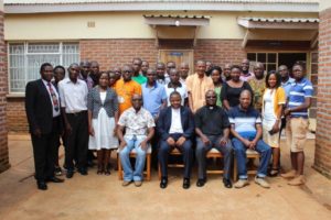 Catholic journalits in a group photo with The Secretary General and Fr. Godino Phokoso
