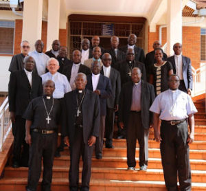 The bishops and other participants pose for a group photo
