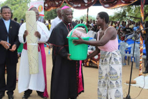 Another Victim receives the items from the Bishops