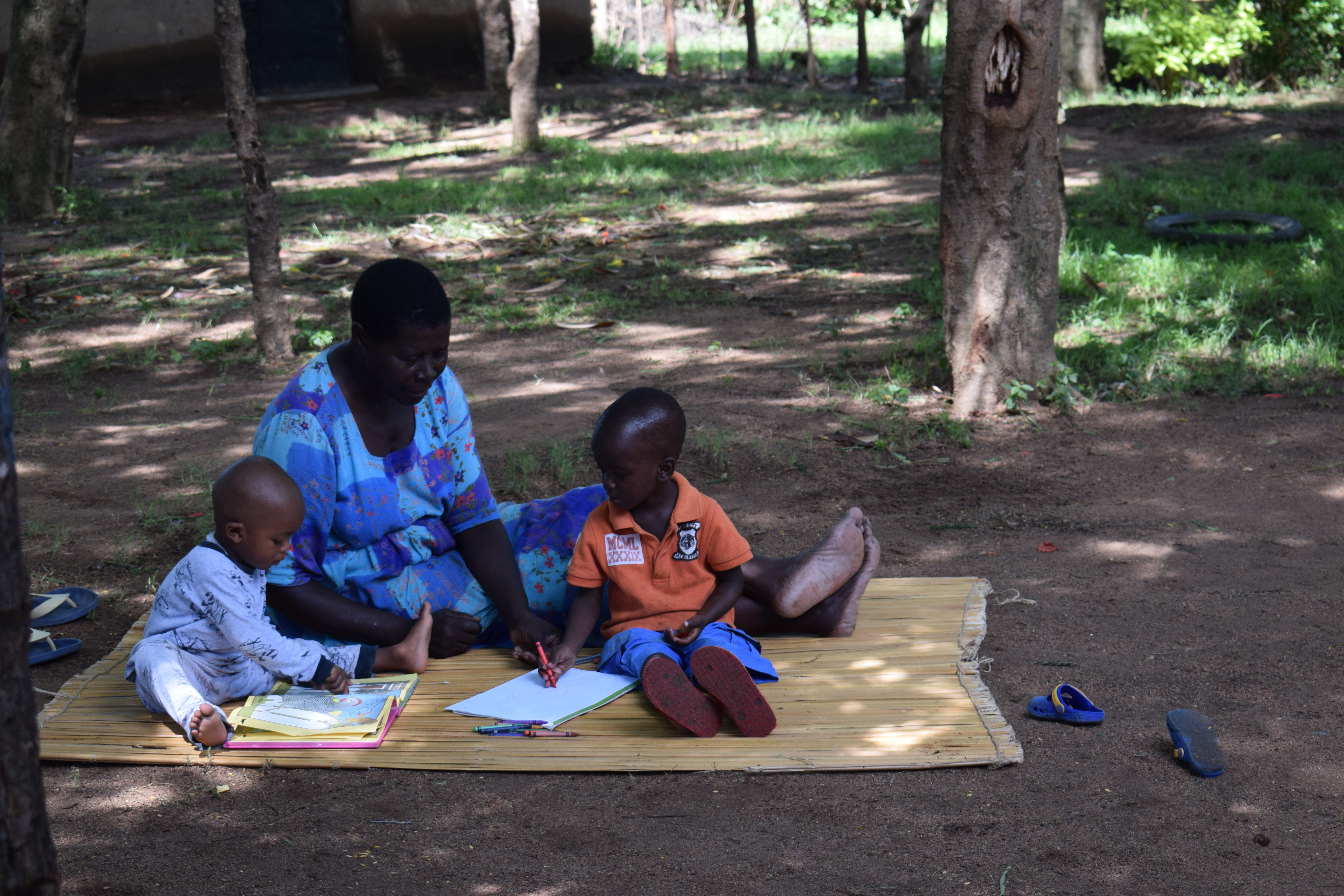 On the Right: Three year old Tony Blair and his little cousin take time learn and draw pictures under the tutorship of their grandmother.