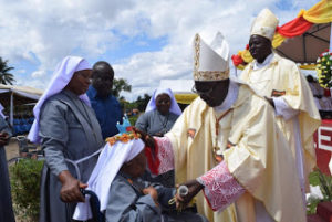Cardinal Pengo blessing Sr. Theresa Namkundi who cellebrates 75 years of sisterhood
