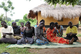 Members of the Lomiriji group in Romogi Sub-county during their group meeting