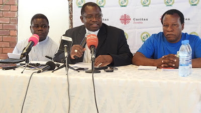 Bishop Chiyemba (C) addressing journalists (not in picture) flanked by ZCCB Secretary General Fr. Cleophas Lungu (l) and Mr. Eugeen Kabilika (R)  