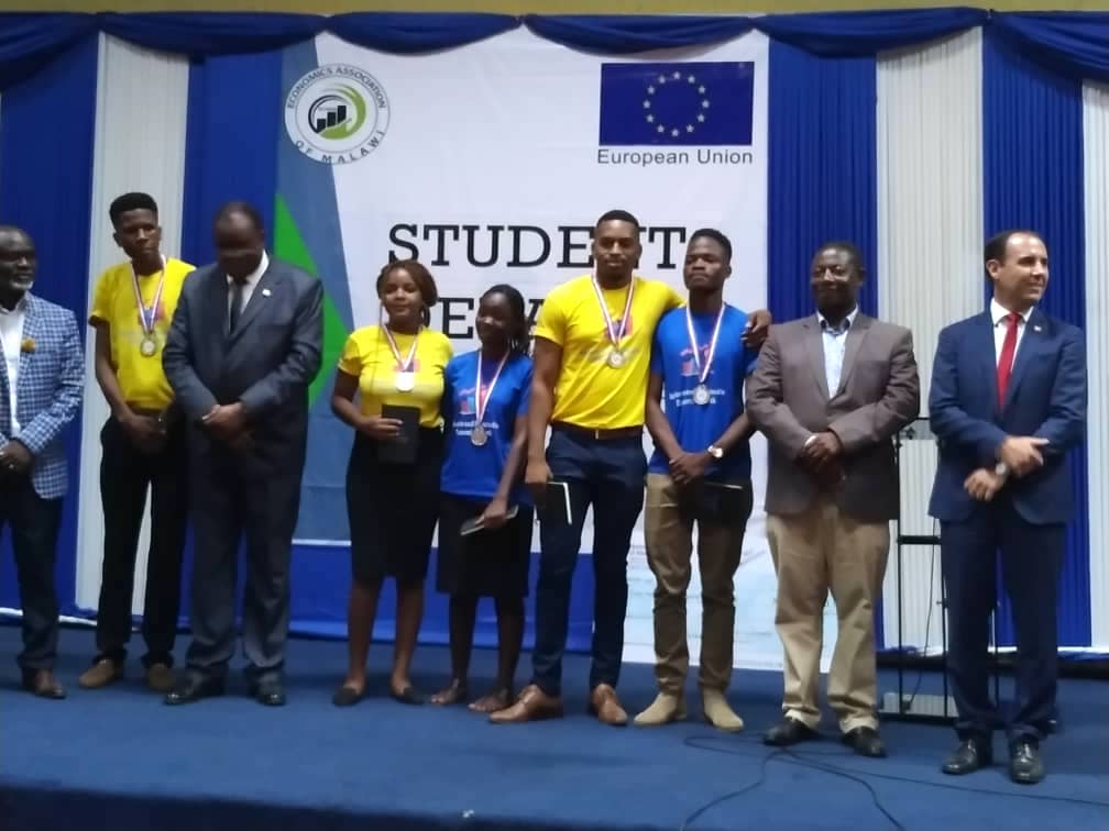 CUNIMA's Debate winning team. with panel