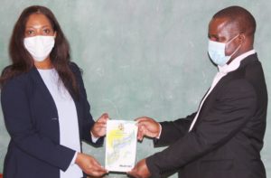 Mjuweni (left) and Nkhoma holds the vision booklet. Credit; Malawi Communications