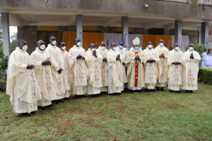 Newly Ordained Priests with Ordaining Bishop Rt. Rev. John Oballa Owaa and Pontifical Commissary Fr. Raphael Wokorach