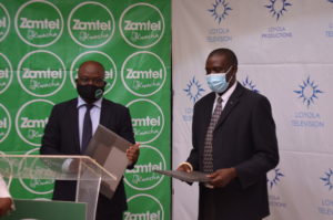 From left; Sydney Mupeta ZAMTEL Chief Executive Officer and Fr. Patrick Mulemi, SJ Loyola Television Executive Director. Credit; Zambia Communications