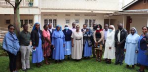 Sr. Anamaria Nankusu, RSCJ, Chairperson, ARU, (centre in cream dress) in a group photo with stakeholders after CCCU tool kit review