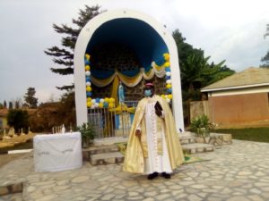 Bishop Sanctus Lino Wanok infront of the grotto giving Catechesis to the Lay faithful