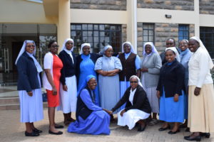 The Pre-COVID-19 ACWECA Chapter Preparatory Committee pose for a group photo outside Radix - the place of the Apostles of Jesus in Langata in Nairobi - Kenya.