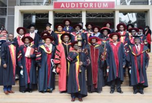 Rt. Rev. Paul Kariuki Njiru and Very Rev. Prof. Stephen Mbugua Ngari pose for a photo with University Officials after the Convocation Ceremony