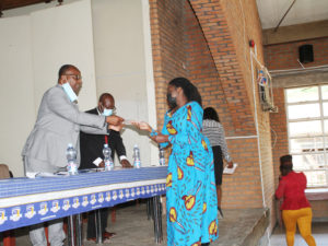 Fr. George Buleya applauds female students from the University