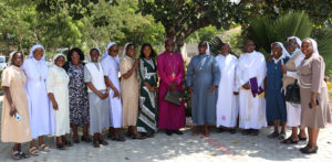 Archbishop Martin Kivuva Musonde together with Religious Sisters communicators