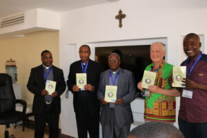Members of the SCCs Training team with Bishop Kilaini after lauching of the SCCs Training Handbook