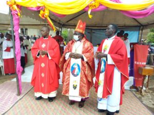 Bishop Kibira with Fr Syathetha the diocesan Treasurer on the left and Fr Tsangamubiri the rector Kabuyiri Shrine on the right at Ndongo Catholic Church