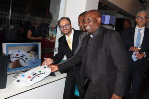 Fr. Mbugua receiving the digital psychological testing kit
