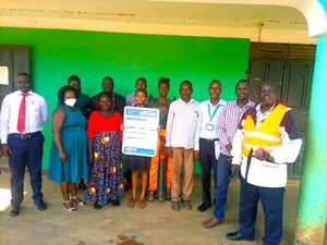 Lead Farmers and Officials from Centenary bank in a group photo shortly after opening Banking Agency at Acholibur town council in Pader district recently.