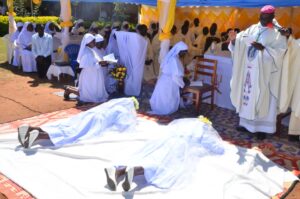 Bishop Sanctus Lino Wanok Praying over the Religious Sisters during the Rite of the Perpetual profession of MSMMC Ngetta in Lira