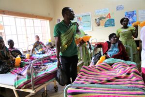 Some of the ECM staff members distributing items to patients at the hospital